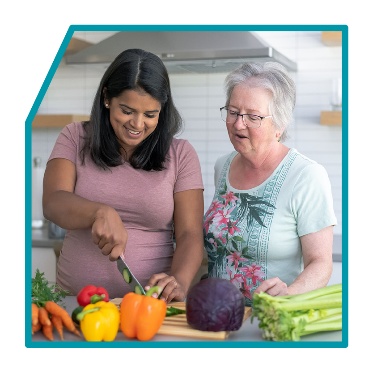 2 people making a meal together.