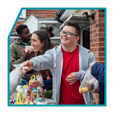 A person running a market in their community.