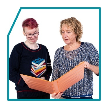 2 people reading a document. 