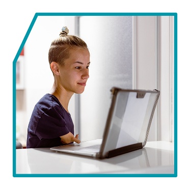 A person using a laptop.